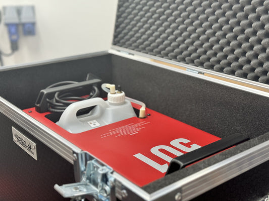 Close-up of MSS Trainer 301 smoke machine placed inside black foam-lined flight case with secure metal fittings.