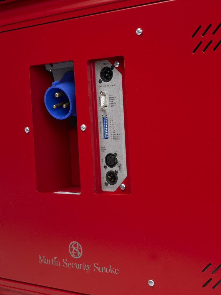 Close-up of rear connection panel on MSS Trainer X-Stream smoke machine showing blue power connector and XLR input/output ports.