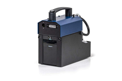 The POWER-TINY Hand Held Small Fog Generator by Look Solutions is a compact, rectangular, off-mains fog machine with a black base, blue top, handle, power switch, cable, and caution label—delivering powerful fog output for flexible use.