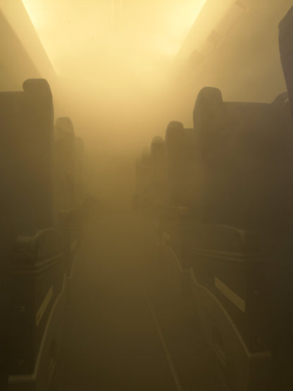 Simulation of dense smoke inside an aircraft cabin created by the 301 Trainer smoke machine for realistic evacuation and fire safety training.