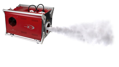 Red MSS Trainer X-Stream smoke machine with silver protective frame producing a powerful stream of dense white smoke.